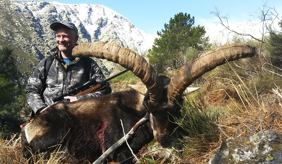 Hunter with his Gredos ibex hunting trophy 