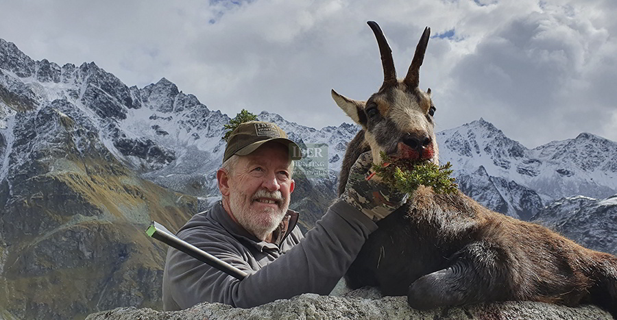 Hunter with chamois alpine in Austria