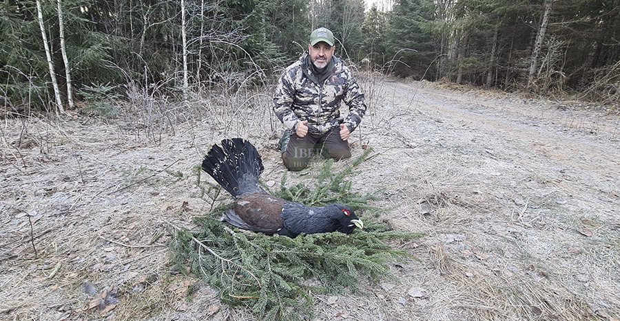 Hunter with Capercaillie hunting trophy