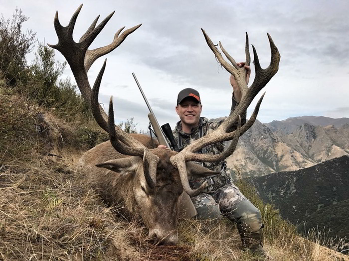 Nick Hoffman with his red deer hunting trophy in New Zealand