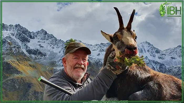 Hunter with chamois alpine in Austria