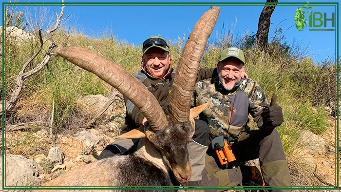 Hunters with a Beceite ibex in Spain
