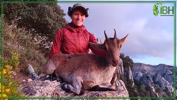 Young huntress with Ronda ibex female hunting trophy
