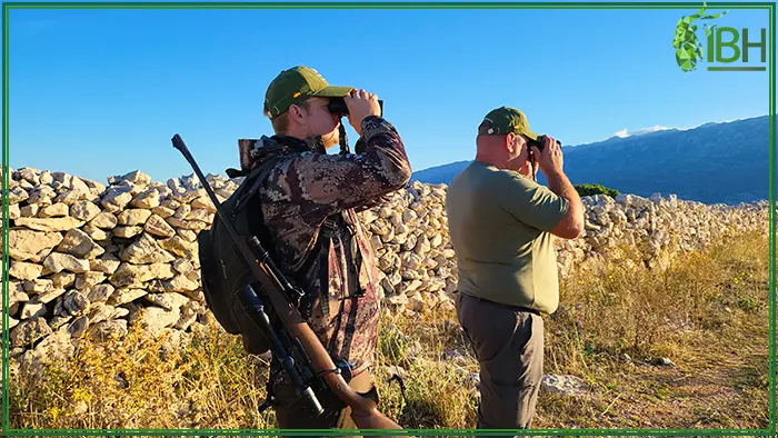 Hunter and his guide looking for a trophy in Croatia
