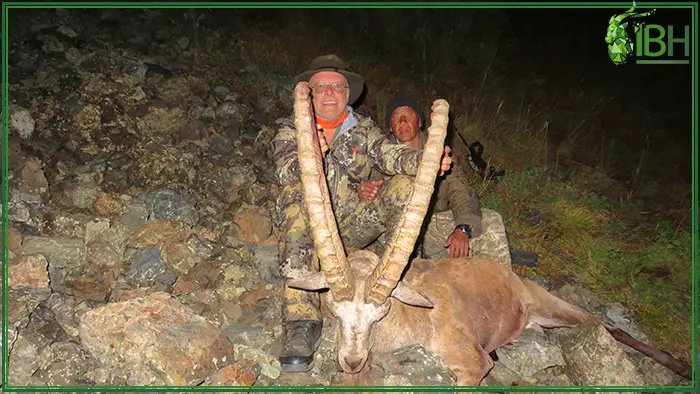 Hunter at night with his mid asian ibex hunting trophy