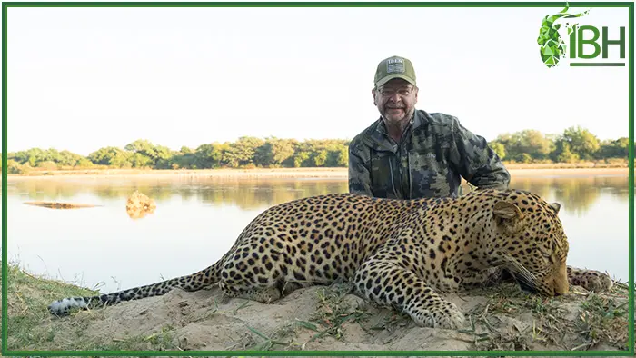 Picture of a Hunter and his leopard hunting trophy in Zambia