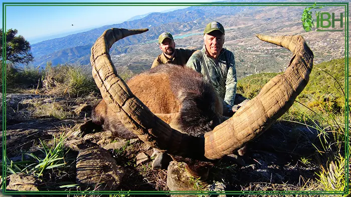 Father and son with his Ronda ibex hunting trophy