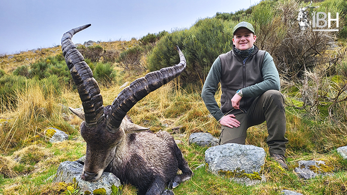Young hunter with his trophy hunt of Gredos ibex in Spain
