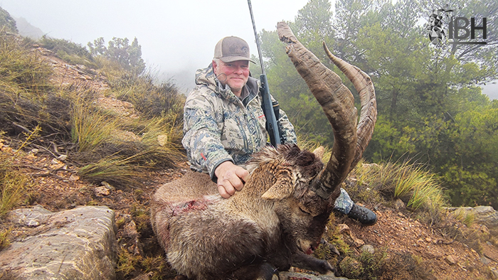 Perry with his hunting trophy of Southeastern ibex in spain