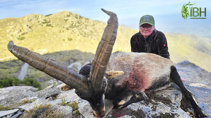 Huntress with her hunting trophy of Sierra Nevada in Spain