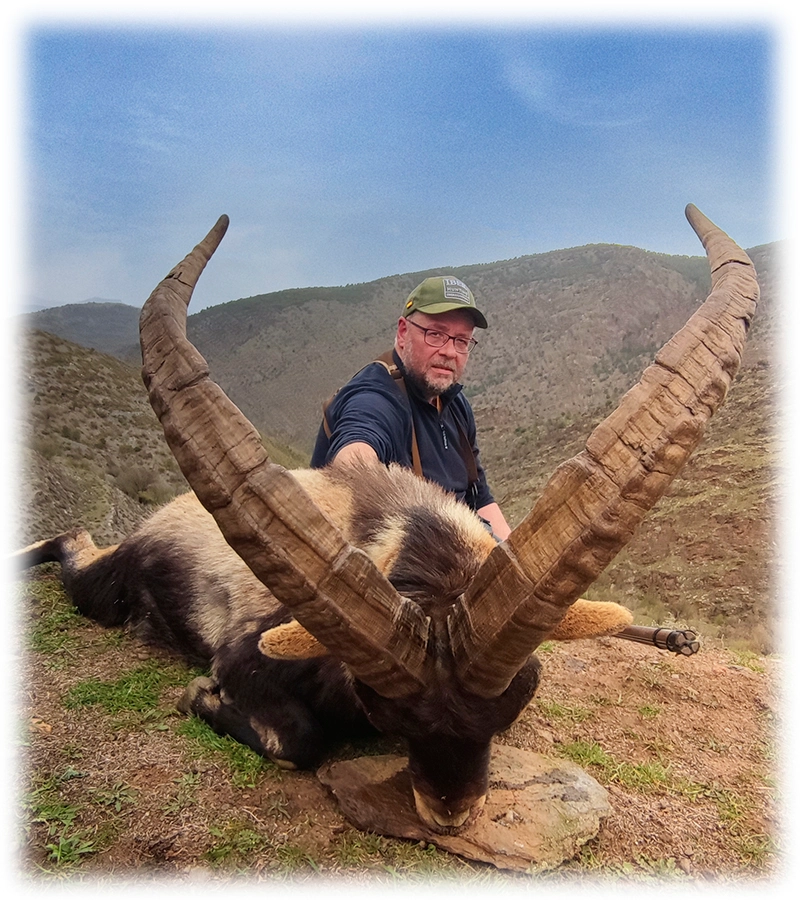 Hunter with his Hunting trophy of Spanish Southeastern ibex