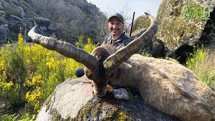 Hunter Kris with his trophy hunt of Gredos ibex