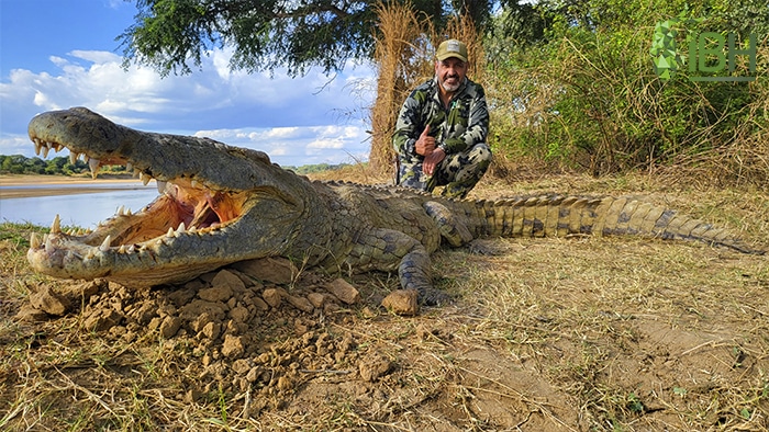 Antonio with a crocodile hunting trophy in Zambia
