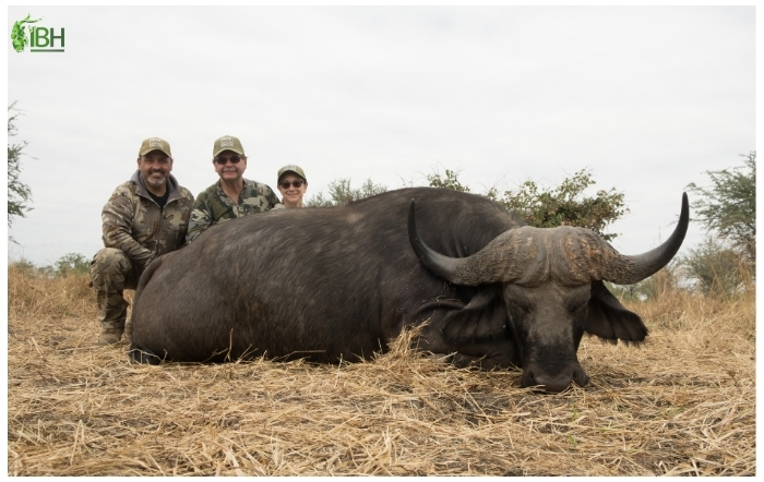 Rusty with his wife and Antonio from IberHunting posing with the Buffalo hunting big five in Africa 