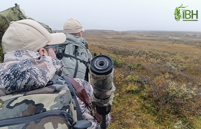 Hunters admiring the landscape of the hunting area in Norway