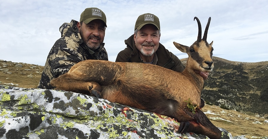 Hunter and outfitter with a Pyrenean chamois hunting trophy