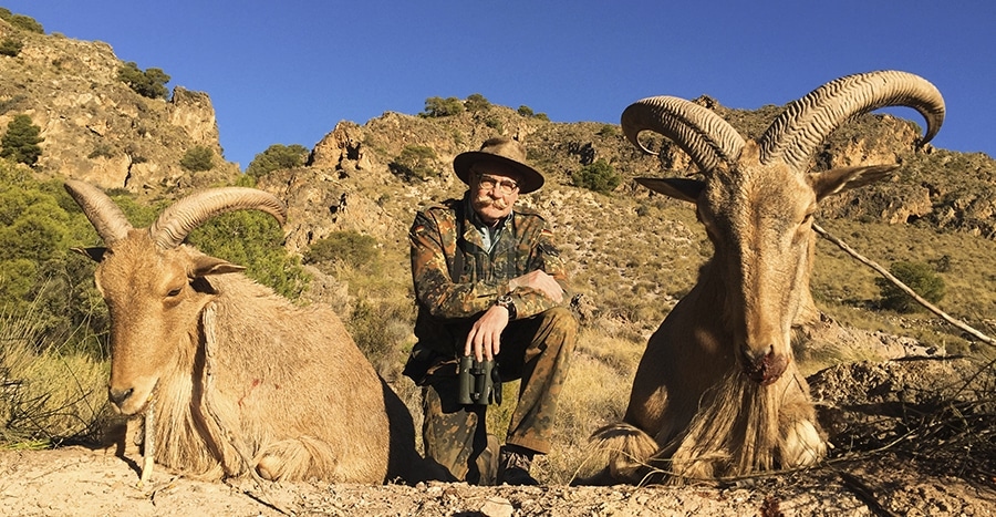 Hunter with his two aoudad sheep hunting trophies