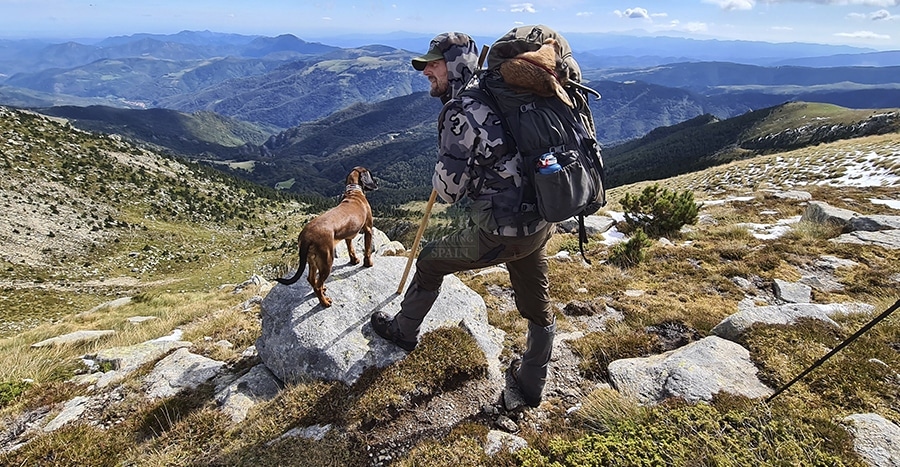 Hunter looking the landscape of mountains